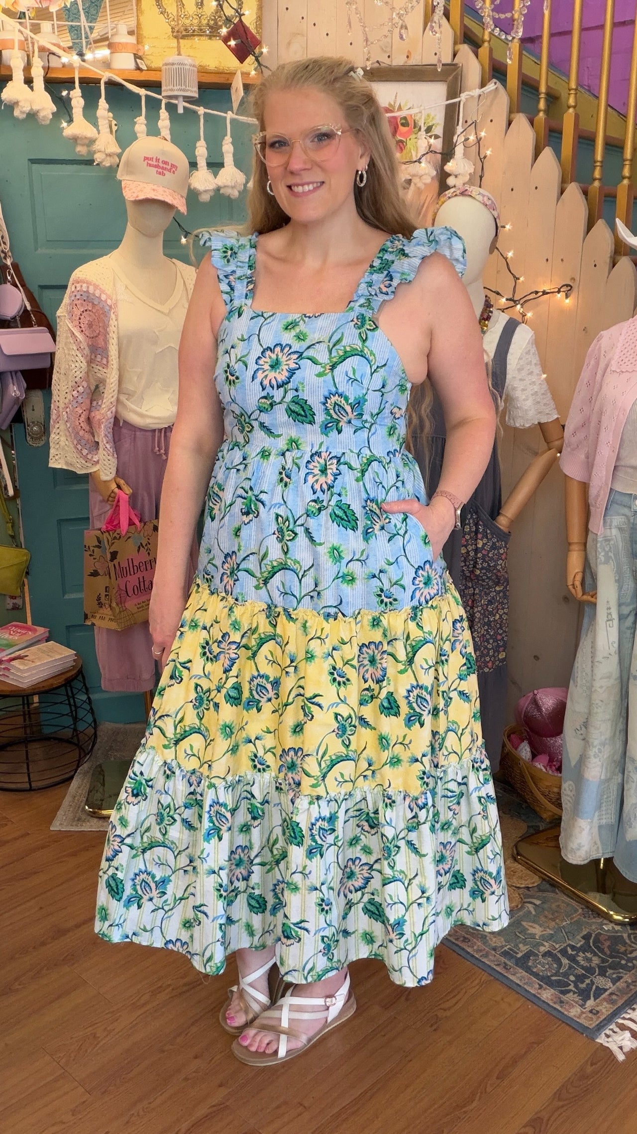 sachin and babi light blue dress Look 3. Glass velvet column gown with exaggerated puff sleeve and embroidered  tulle overlay. Look 4. Silk taffeta gown with exaggerated sleeve and ruffle  skirt detail. Look 1. Off the shoulder scallop